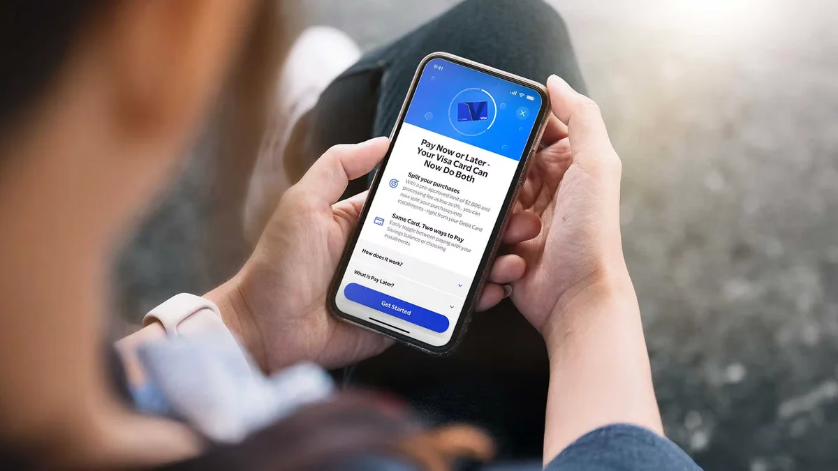 Person using the Pay Now or Later feature on a Visa card in the Visa mobile app